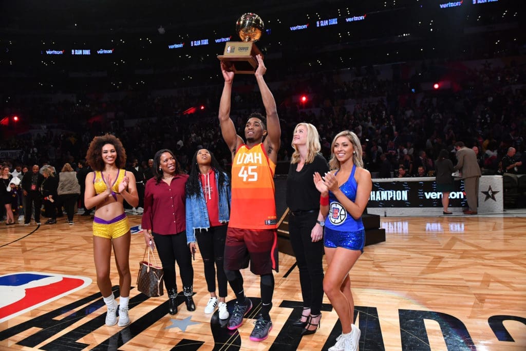 Donovan Mitchell holding Dunk Champion trophy