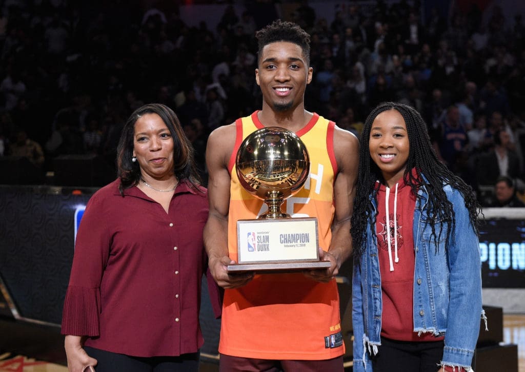 Donovan Mitchell holding Dunk Champion trophy