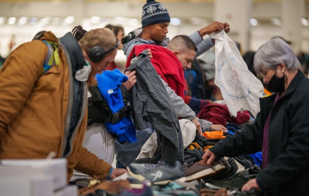 People looking through clothing